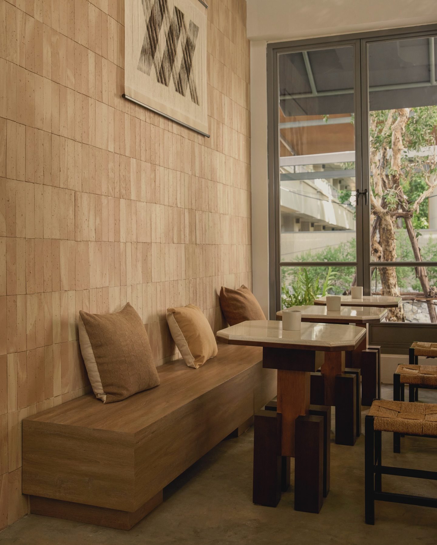 Tables by the window at Bones Cafe