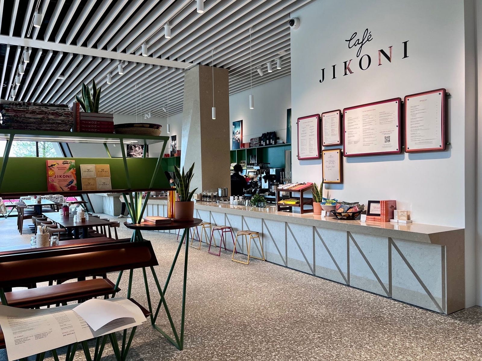 The dining room at Café Jikoni, looking onto the museum windows