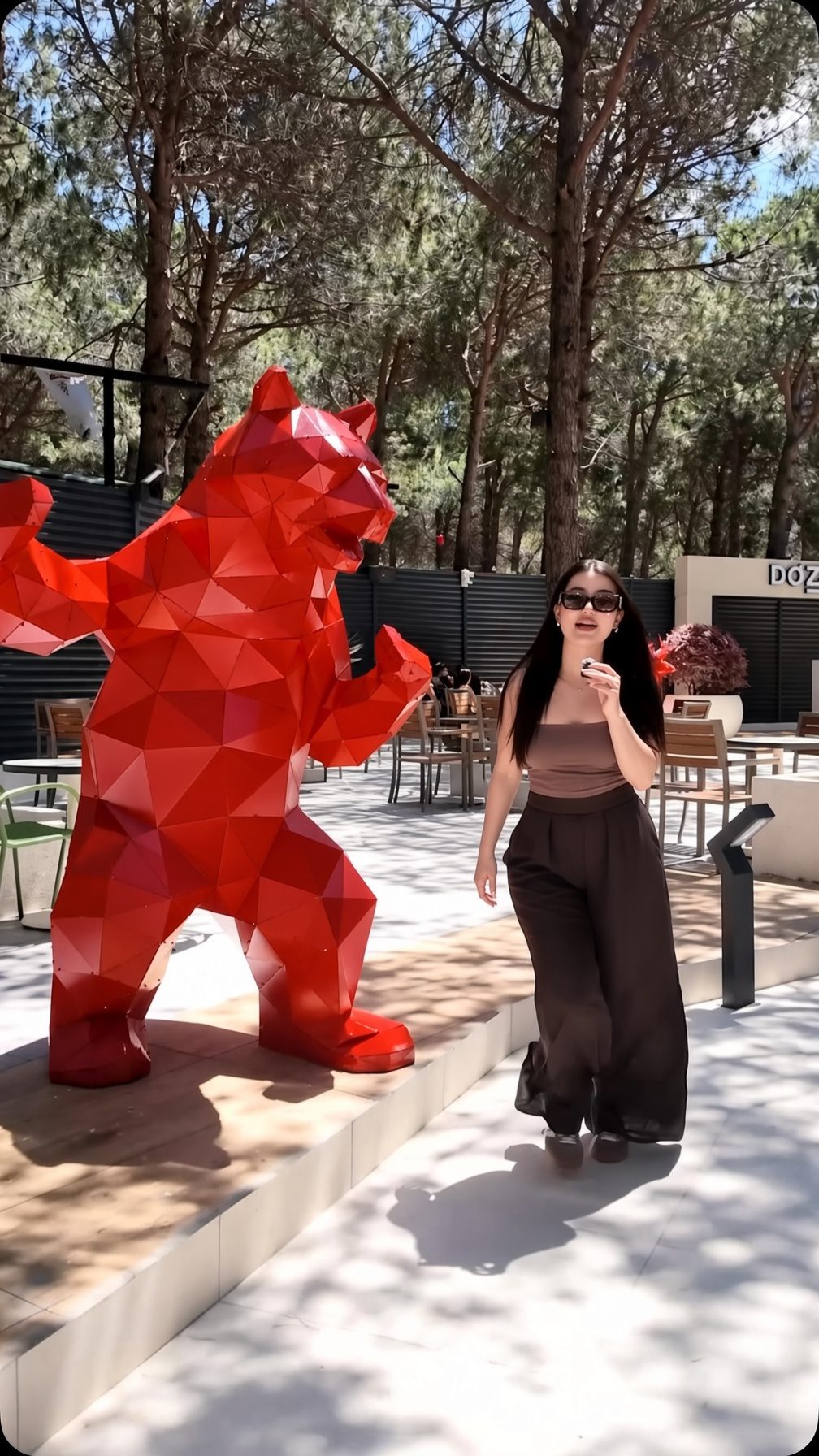 The outdoor yard and red sculpture at Dozze Orman